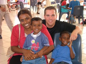 A happy family posing together for a close-up photo.