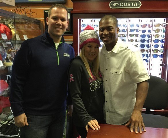 Tyler Lockett with fans at Costa sunglasses display
